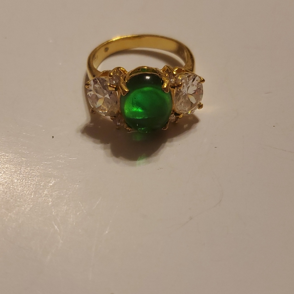Faux Emerald center stone and Crystals on side sz5